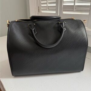 Black handbag with detachable shoulder strap